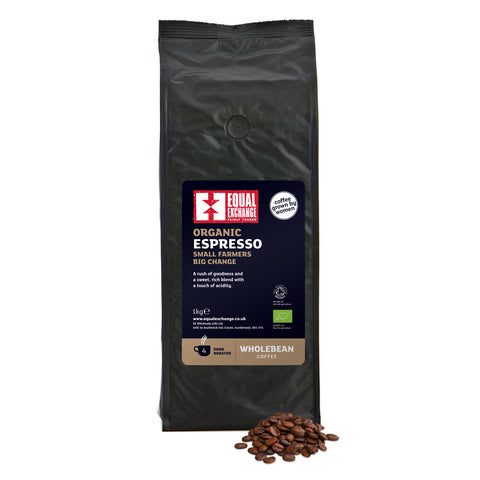 front of Organic Espresso dark roast 1kg coffee bag with a pile of roasted beans