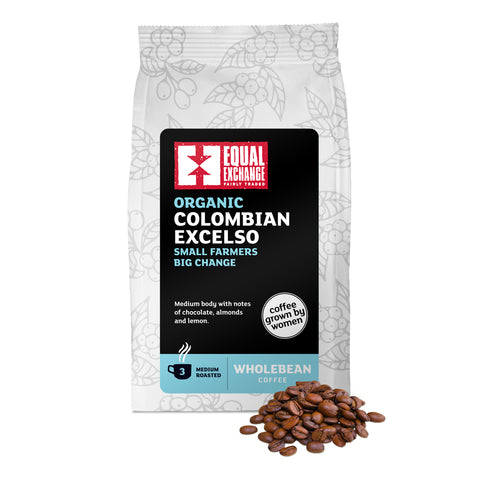 front of Organic Colombian Excelso medium roast coffee bag with roasted coffee beans