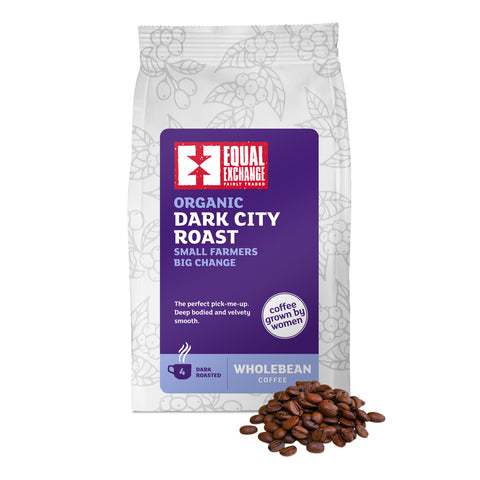 Organic Dark City Roast Whole Bean Coffee bag with a pile of coffee beans