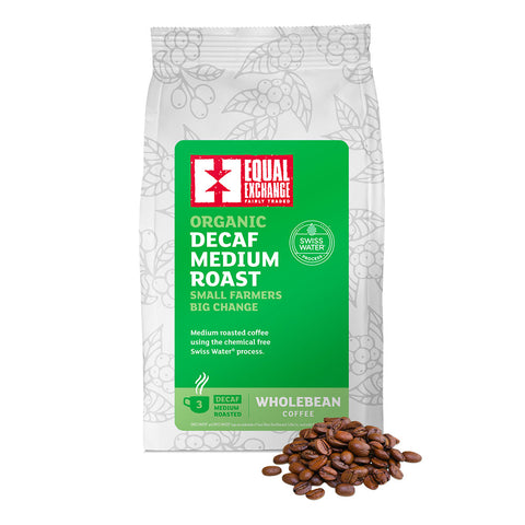 front of Organic Decaf Medium Roast coffee bag with pile of roasted beans