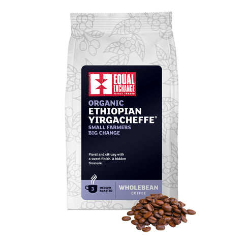 front of Organic Ethiopian Yirgacheffe medium roast coffee bag with pile of roasted beans