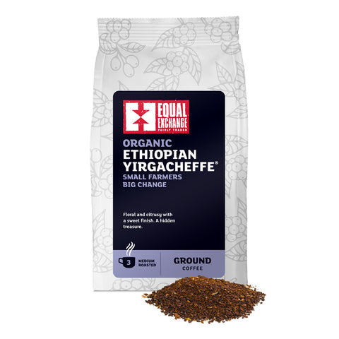 front of Organic Ethiopian Yirgacheffe medium roast coffee bag with pile of ground coffee