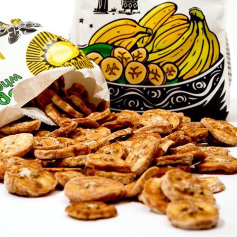 open Tropical Wholefoods bag with dried banana chips spilling out