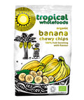 A bag of Tropical Wholefoods organic dried banana chewy chips that reads 100% fruit bursting with flavour