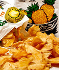 open Tropical Wholefoods bag with dried pineapples spilling out