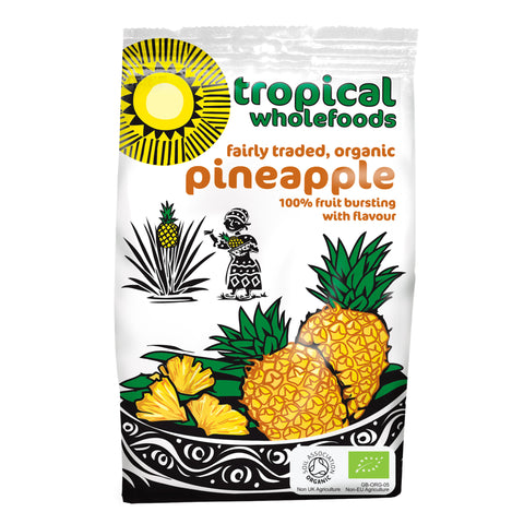 A bag of Tropical Wholefoods fairly traded organic dried pineapple that reads 100% fruit bursting with flavour