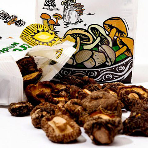 open Tropical Wholefoods bag with dried shiitake mushrooms spilling out