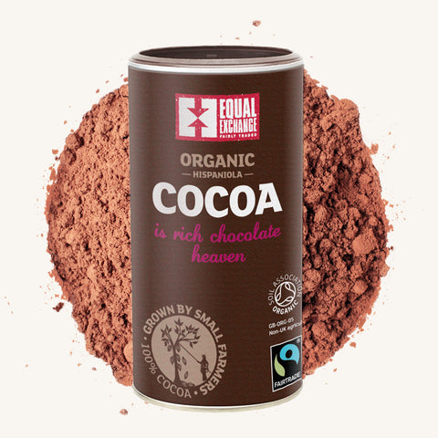 can of Equal Exchange Organic Cocoa over pile of cocoa powder in background