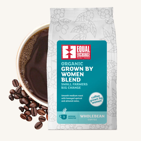 bag of Organic Grown by Women Blend coffee with roasted beans and cup of brewed coffee