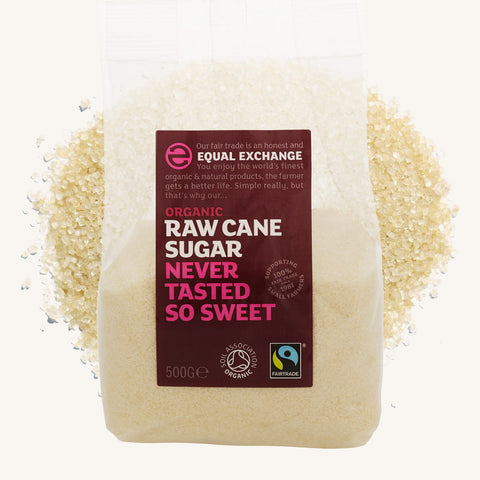 bag of Equal Exchange Organic Raw Can Sugar over pile of cane sugar in the background