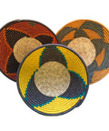 group of three handwoven baskets shown in red, yellow, and orange colors